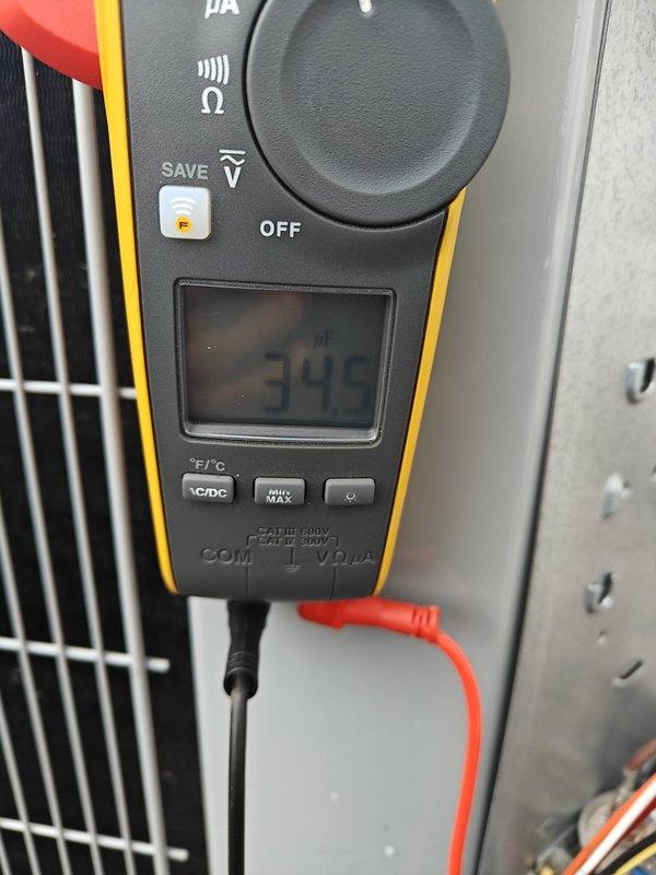 Performed annual heating system maintenance service. Conducted electrical measurements with readings of 345 volts verified using multimeter. Inspected ductwork and ventilation components, confirming proper condition of metal surfaces with no visible damage or deterioration.