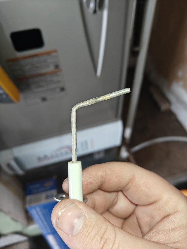 Performed annual heating maintenance service, including voltage testing of electrical components with readings of 5.4 DC observed. Utilized specialized adjustment tool to calibrate system components and completed comprehensive inspection of the heating unit. Customer provided maintenance renewal payment on site.