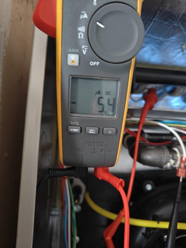 Performed annual heating maintenance service, including voltage testing of electrical components with readings of 5.4 DC observed. Utilized specialized adjustment tool to calibrate system components and completed comprehensive inspection of the heating unit. Customer provided maintenance renewal payment on site.