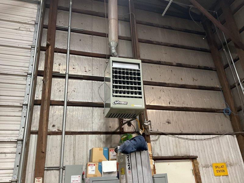 Successfully installed a new Modine MDPDP150AE0130 gas-fired unit heater in the industrial space, connecting it to existing hanging hardware, flue, electrical, and gas lines. Additionally installed a new Honeywell TH232WF4010 programmable thermostat to provide improved temperature control for the commercial facility.