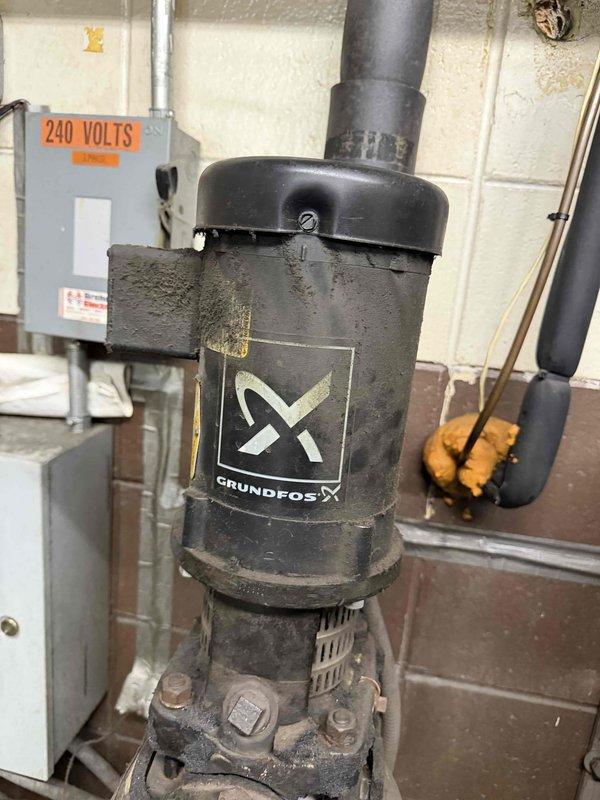 Responded to service call for two non-operational hanging heaters in the EDM area. Inspected Grundfos pump system and associated electrical components, including 240V connections. Examined unit's electronic control module which showed signs of wear, requiring further diagnosis to restore heating functionality.