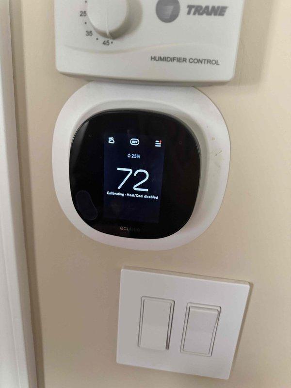 Responded to service call for furnace emitting clicking sounds. Diagnosed potential control board relay failure or electrical short causing system resets based on customer-provided video evidence. Discovered clogged condensate trap during inspection and documented thermostat in calibration mode. Scheduled follow-up service appointment for comprehensive repair.