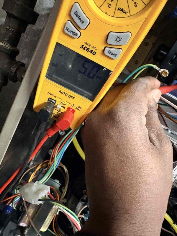 Performed first heating service maintenance on system. Inspected control board and wiring connections for proper operation. Conducted electrical testing with multimeter (SC640) to verify voltage readings and ensure all components were functioning within manufacturer specifications.