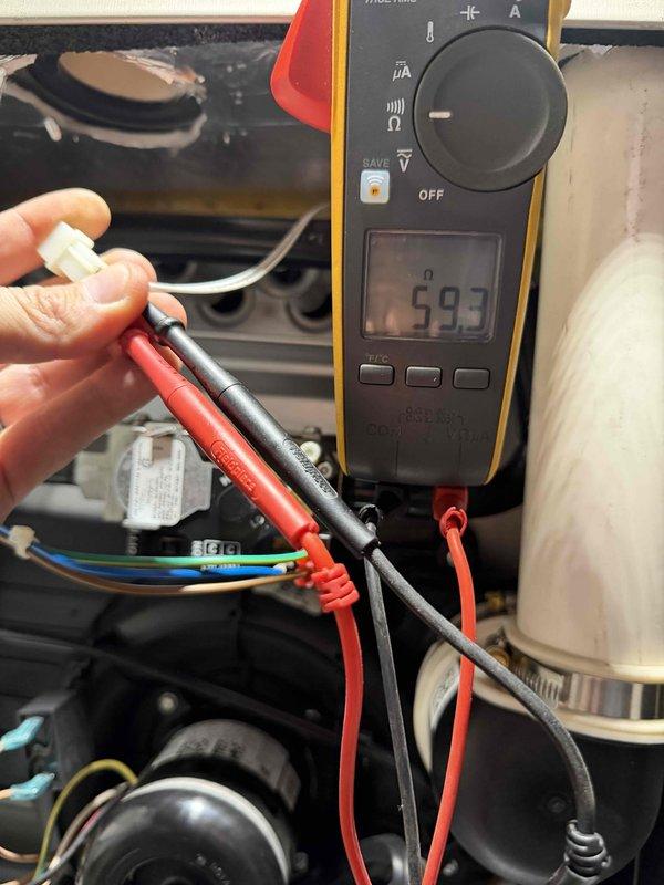 Performed annual heating maintenance service including electrical testing of Genteq ECM motor with multimeter confirming proper resistance values at 59.3 ohms. Visual inspection of motor wiring connections and mounting showed all components in good working condition with no signs of deterioration or damage.