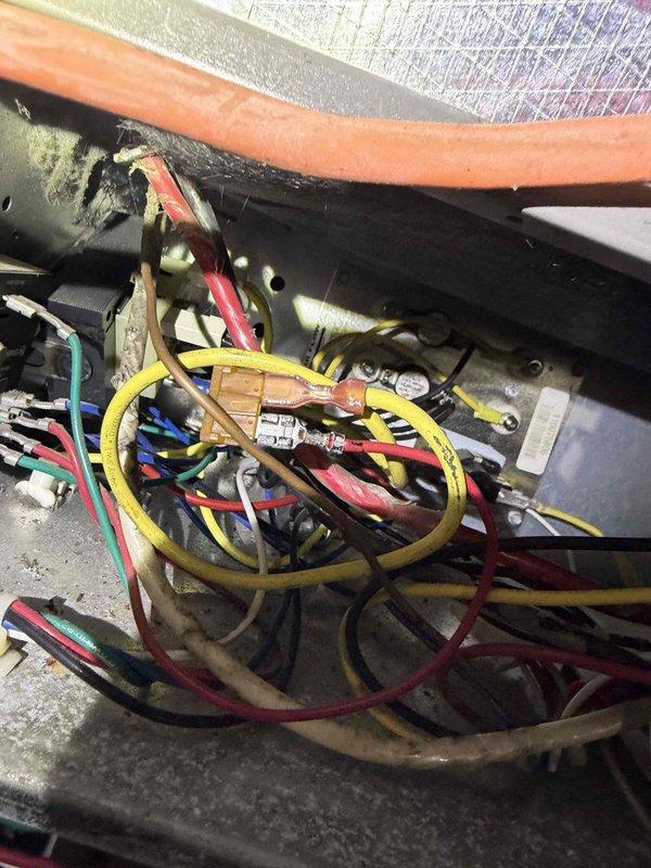 Responded to no-heat service call for a new customer with a reported humming noise from the furnace and subsequent complete system failure. Upon inspection, observed aged wiring connections within the control compartment showing signs of dust accumulation and possible deterioration. Identified wiring issues at the terminal connections that were causing the system malfunction and repaired faulty electrical connections to restore proper heating function.