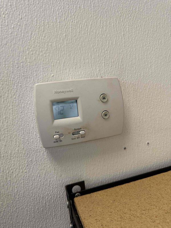 Performed comprehensive site assessment for new commercial maintenance plan development. Inspected Honeywell thermostat system (currently set at 72°F with functional cooling/heating modes) and evaluated blower assembly showing normal dust accumulation with intact belt drive system. Gathered necessary equipment specifications and system data for maintenance program implementation.