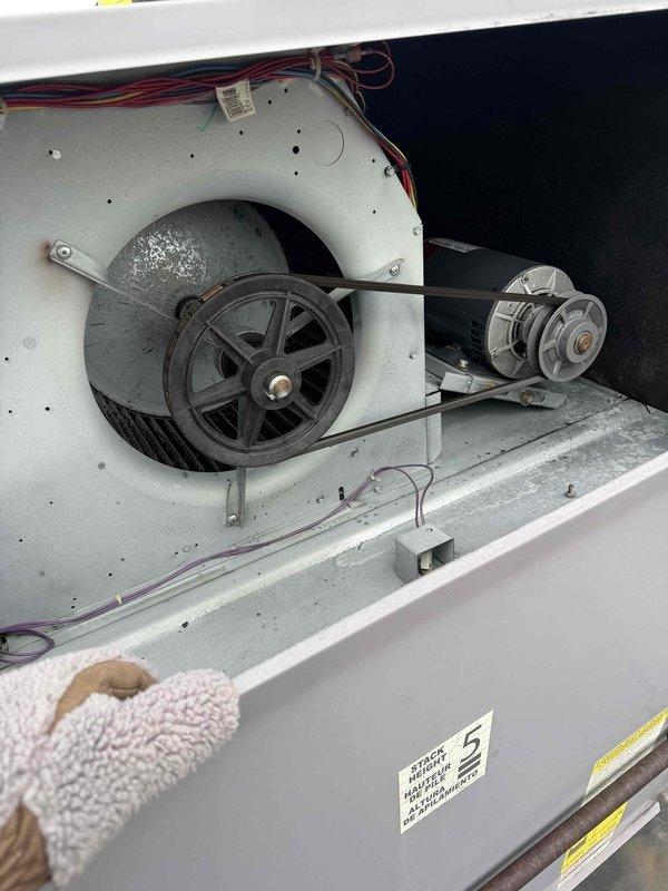 Performed comprehensive site assessment for new commercial maintenance plan development. Inspected Honeywell thermostat system (currently set at 72°F with functional cooling/heating modes) and evaluated blower assembly showing normal dust accumulation with intact belt drive system. Gathered necessary equipment specifications and system data for maintenance program implementation.