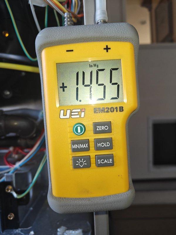 Completed heating maintenance on system. Performed static pressure testing with UEi DM201B meter, measuring both supply (+3.755 In-Wg) and return (1.455 In-Wg) pressure readings to verify proper airflow through the system.
