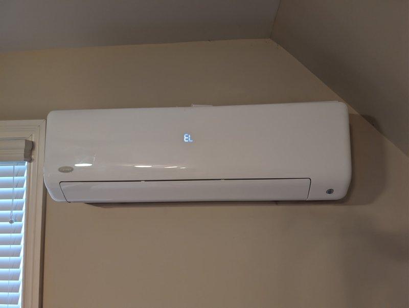 Responded to service call for non-functioning mini-split system. Inspected wall-mounted unit displaying "8t" on digital readout. After diagnostic testing, restored proper operation by clearing error code and verifying system performance. Customer can now discontinue use of backup baseboard heating.