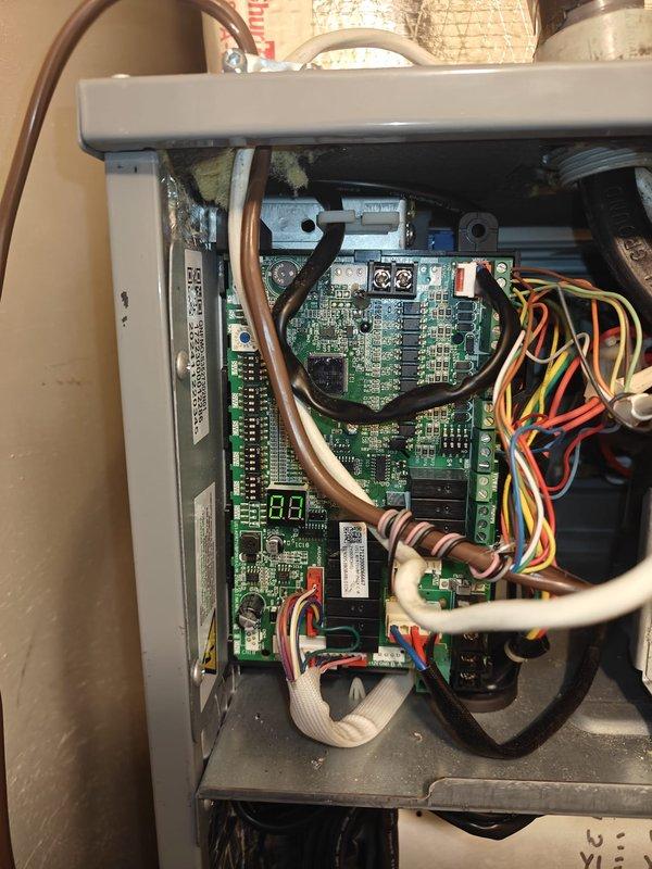 Performed regular maintenance on heating system, including inspection of electrical components. Conducted amperage testing with Fluke 902FC clamp meter showing 0.1 Amps AC on control circuit, and verified proper operation of the control board with functional digital display. All connections and wiring harnesses were inspected and confirmed to be secure with no signs of damage or corrosion.