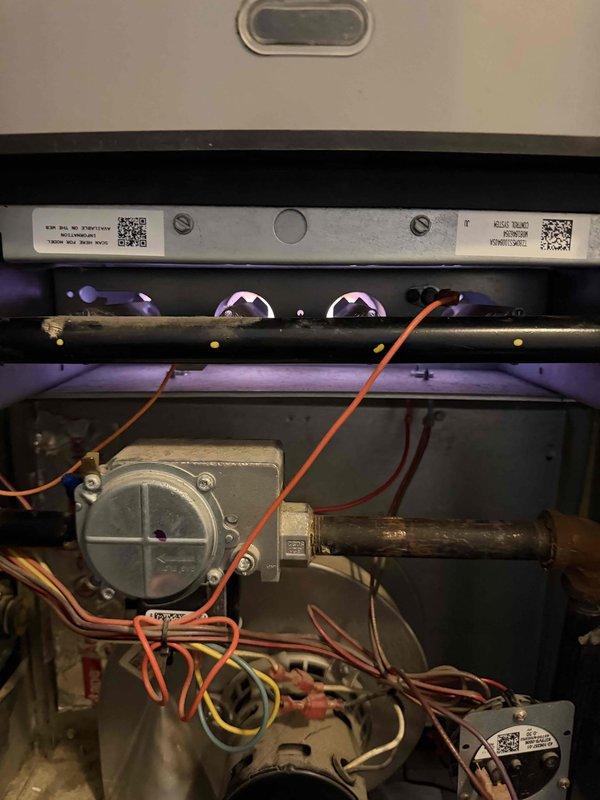 Completed quoted HVAC repair work by replacing damaged electrical wiring in the system. Inspection revealed a red/white striped wire with compromised insulation exposing copper conductor. Replaced damaged wire and verified proper connection to restore system functionality.