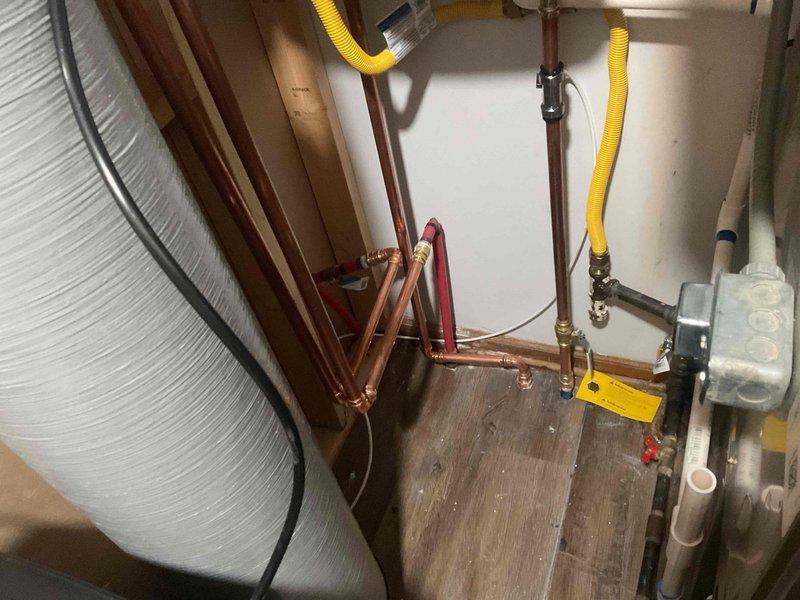 Performed comprehensive installation of a new tankless water heater system integrated with a water filtration unit. Installation included copper pipe connections with appropriate fittings, securing all plumbing connections, and ensuring proper drainage via PVC piping system. Completed electrical connections and verified proper operation of all components before concluding service.