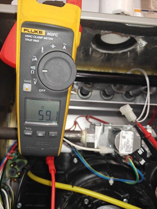 Completed annual heating maintenance service on tankless water heater including system flush. Electrical diagnostics performed using Fluke 902FC meter, measuring resistance (59.1 ohms) and verifying current draw (4.3 Amps AC) within manufacturer specifications. Customer renewed maintenance contract for continued system protection.