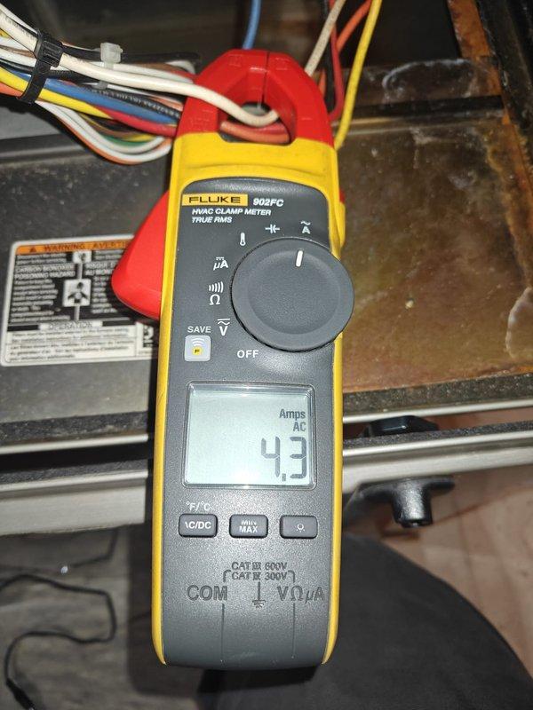 Completed annual heating maintenance service on tankless water heater including system flush. Electrical diagnostics performed using Fluke 902FC meter, measuring resistance (59.1 ohms) and verifying current draw (4.3 Amps AC) within manufacturer specifications. Customer renewed maintenance contract for continued system protection.