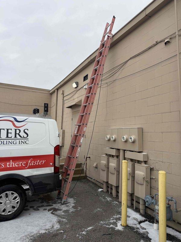 Conducted site assessment to gather information for a maintenance plan on a Carrier rooftop HVAC unit. Documented the equipment's location, condition, and specifications as requested by customer, including unit year, gas type, and refrigerant type. Photographs were taken of both the building exterior access point and the rooftop unit for documentation purposes.