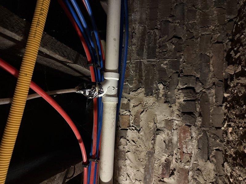 Conducted an on-site evaluation of the property to provide a comprehensive zoning estimate. Inspected existing plumbing infrastructure including PVC, copper, and supply lines mounted against brick wall in basement area. Examined electrical components and wiring configuration to determine compatibility with proposed zoning system.