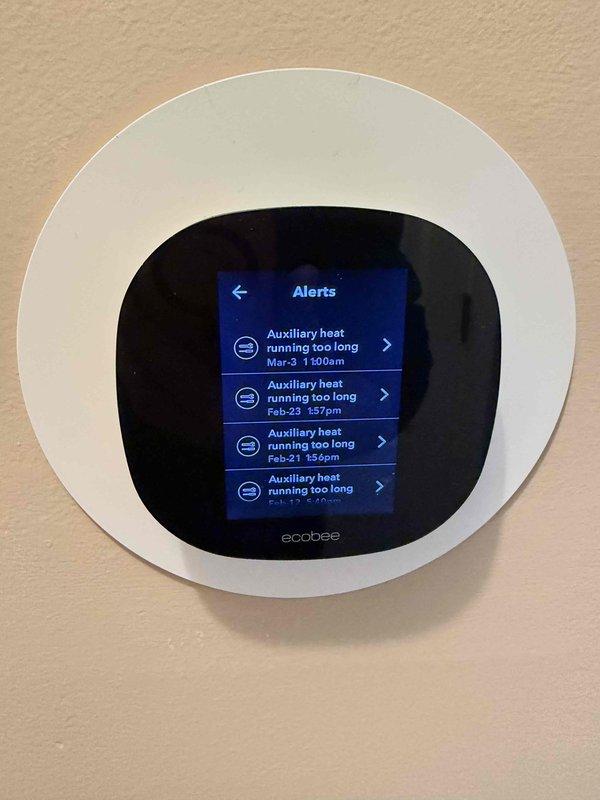 Responded to customer complaint of backup heat running continuously. Conducted diagnostic testing on Trane heat pump system using ammeter to verify electrical performance. Found multiple "Auxiliary heat running too long" alerts on the ecobee thermostat, confirming the system's excessive reliance on backup heat. Inspected control board connections and verified proper operation of the heat pump.