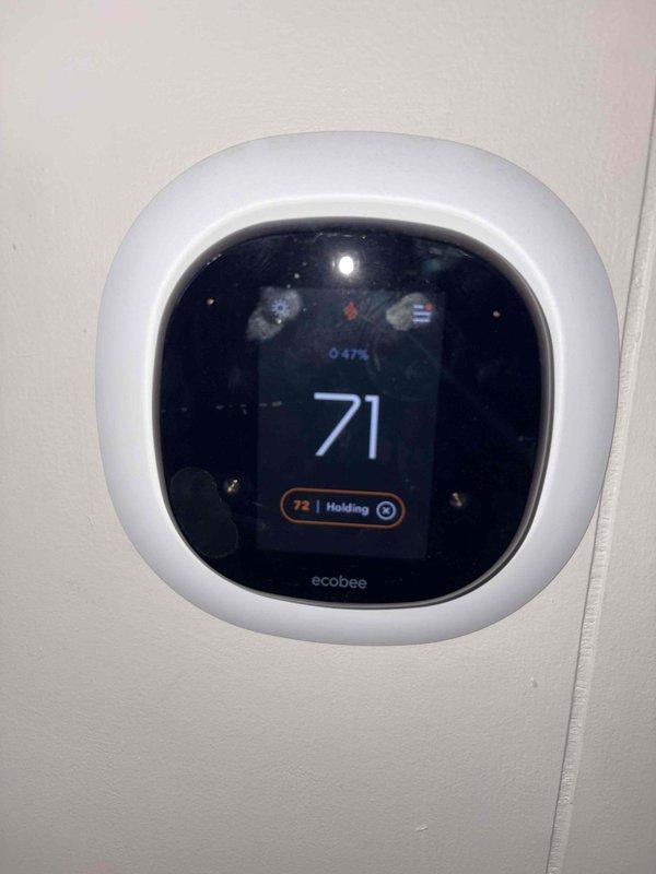 Performed annual heating maintenance service on system. Verified Ecobee thermostat functioning correctly with proper temperature display and hold settings. Conducted electrical diagnostics with multimeter, confirming voltage readings of 12.29 and 12.23 across control wiring. System is operating within manufacturer specifications.