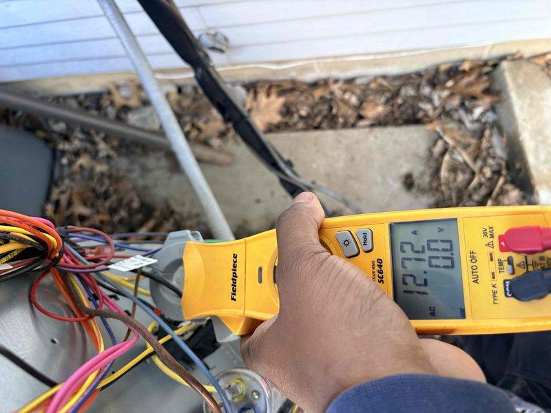 Performed annual heating maintenance service on system. Verified Ecobee thermostat functioning correctly with proper temperature display and hold settings. Conducted electrical diagnostics with multimeter, confirming voltage readings of 12.29 and 12.23 across control wiring. System is operating within manufacturer specifications.