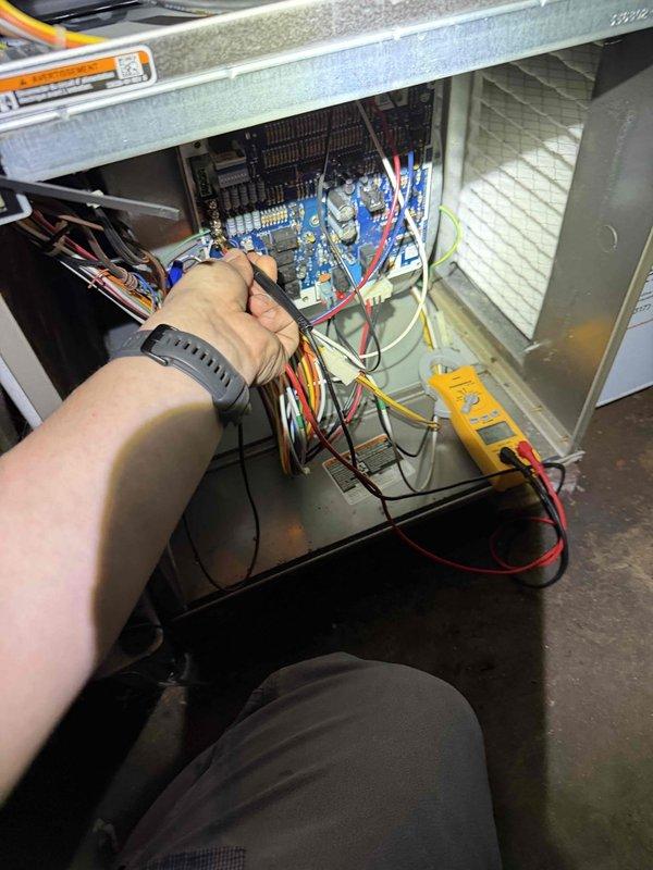 Diagnosed AC system failure reported as "not coming on" while heating function was operational. Performed electrical diagnostics on control board using multimeter to test connections and components. Identified and repaired faulty wiring connection at the control board, restoring proper communication between thermostat and air conditioning system.