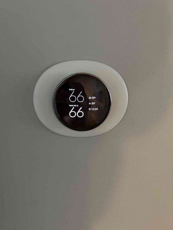 Conducted a comprehensive evaluation of the existing HVAC system for potential replacement, including inspection of the current Goodman outdoor condensing unit and digital programmable thermostat. Documented the current installation configuration, noting the condition of electrical connections, thermostat functionality, and exterior unit placement on proper gravel drainage bed for quote preparation.