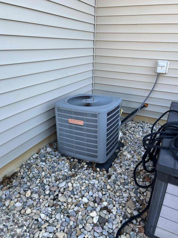 Conducted a comprehensive evaluation of the existing HVAC system for potential replacement, including inspection of the current Goodman outdoor condensing unit and digital programmable thermostat. Documented the current installation configuration, noting the condition of electrical connections, thermostat functionality, and exterior unit placement on proper gravel drainage bed for quote preparation.