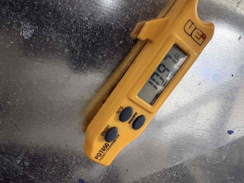 Performed quoted repairs on HVAC system. Temperature measurements were taken using UEi PT150 digital thermometer, recording readings of 123°F on reflective insulation material and 19.9° at another measurement point, confirming proper system operation after repair completion.