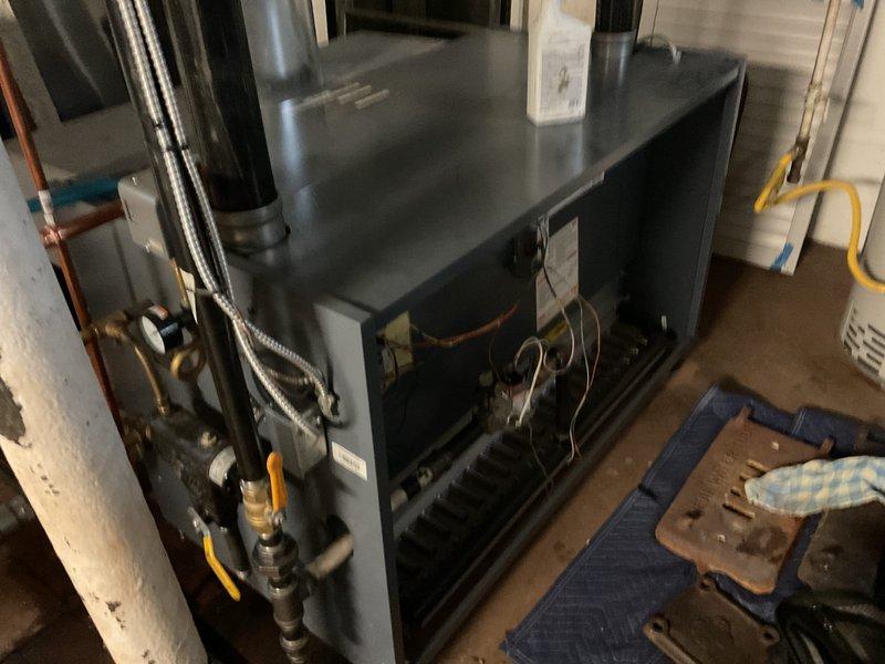 Performed annual heating maintenance on boiler system. Inspected all major components including flue pipes, copper supply lines, and control wiring. System appears to be in normal operating condition with no visible leaks or damage to connections; all valves and safety controls functioning properly.