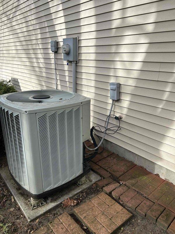 Conducted comprehensive system replacement estimate for 20-year-old HVAC unit. Existing outdoor condenser shows significant age with weathered connections and deteriorated mounting. Electrical inspection revealed concerning dust/debris accumulation in breaker panel with two 50-amp breakers, indicating potential safety hazards requiring attention during replacement.