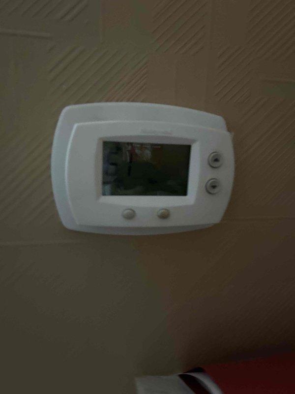 Performed comprehensive evaluation of existing HVAC system following referral from existing client. Visual inspection revealed failed heat exchanger and malfunctioning control board requiring full system replacement. Documented existing thermostat configuration and evaluated current ductwork in utility area to prepare detailed replacement estimate.