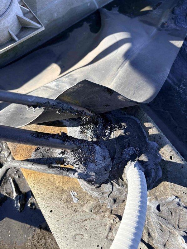 Inspected customer's property regarding water intrusion around RTU flues. Discovered severely damaged roofing membrane with tears and deterioration, allowing water penetration into the building. Documented damaged piping and compromised waterproofing with photos for reference in developing appropriate repair solution.