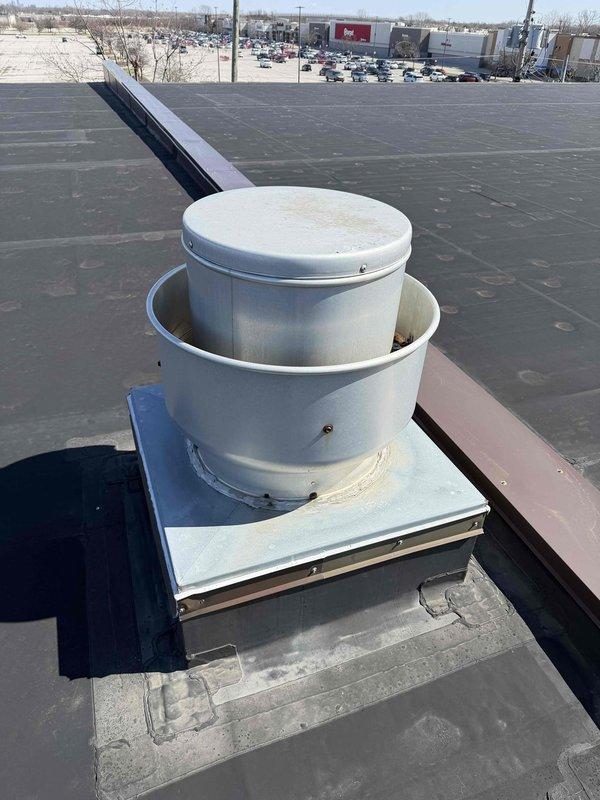 Conducted diagnostic assessment on three malfunctioning split systems and evaluated rooftop exhaust fan which showed significant dirt accumulation and wear. Identified two units with reduced cooling capacity and one completely non-operational system, with recommendation to improve ventilation for units under mezzanine by routing trapped heat through existing flue to exhaust fan.