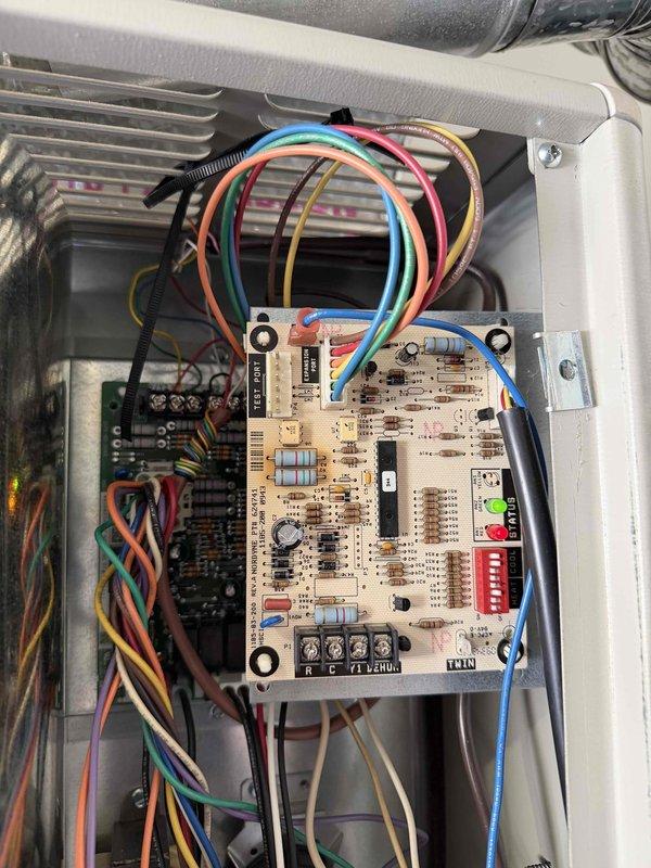 Performed diagnostic inspection on LG system reporting no heat. Examined control board which showed normal operation with illuminated green LED indicator. Traced issue to faulty circuit board connections and repaired loose wiring at terminal blocks, restoring proper heat function.