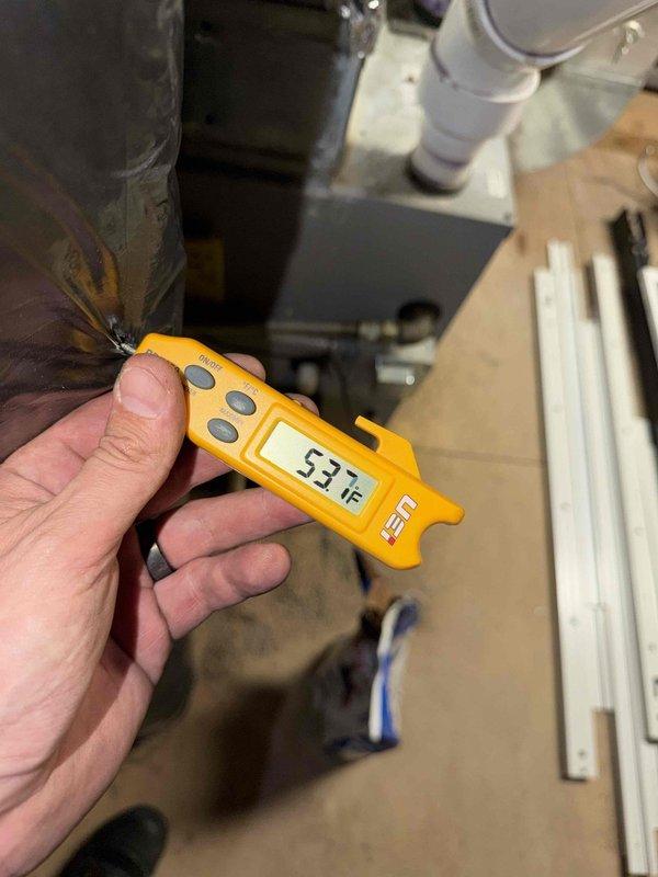 Responded to commercial customer complaint of noise and water leakage from unit above server room. Diagnostic testing revealed significant frost buildup on evaporator coil with temperature readings of 53.7°F, indicating possible refrigerant flow restriction or airflow issues causing condensate overflow.