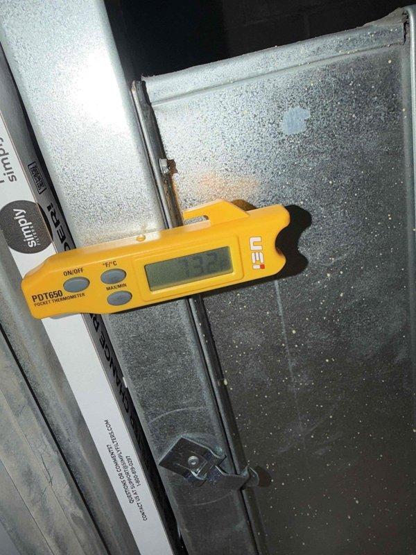 Responded to commercial customer complaint of noise and water leakage from unit above server room. Diagnostic testing revealed significant frost buildup on evaporator coil with temperature readings of 53.7°F, indicating possible refrigerant flow restriction or airflow issues causing condensate overflow.