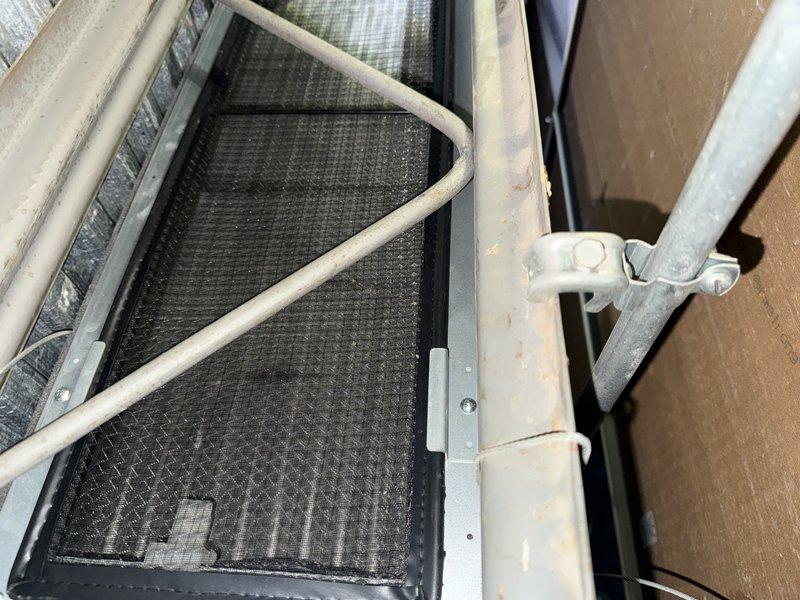 Conducted on-site assessment of existing LG mini-split system for potential replacement. Inspected outdoor condenser unit mounted on brick platform and examined interior components including filter mesh which showed normal dust accumulation. Documented current installation configuration and component conditions to prepare comprehensive replacement estimate.