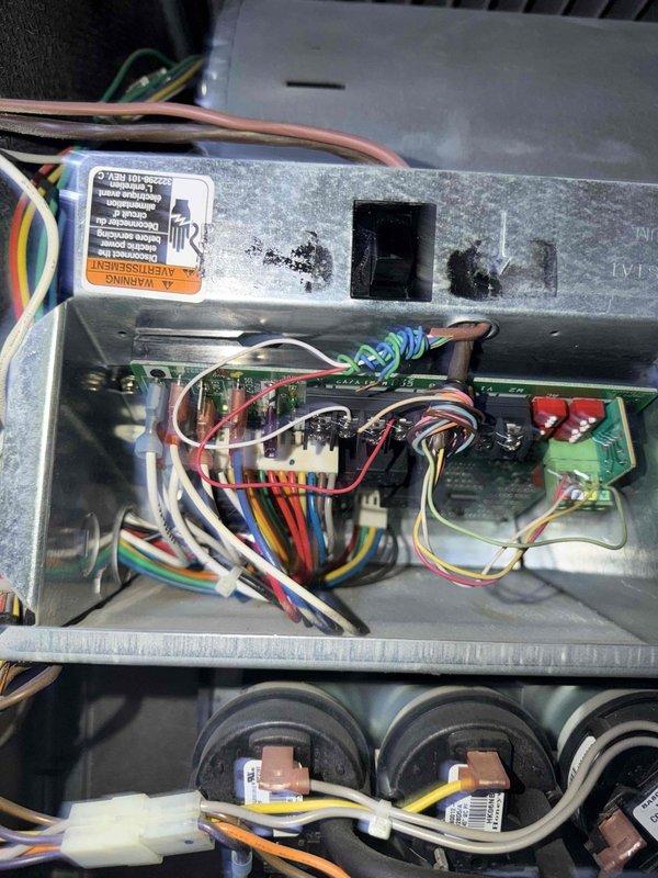 Performed comprehensive furnace tune-up and maintenance service. Inspected control board components and wiring connections in the electrical control box, noting all connections were secure with no visible damage. Examined blower wheel assembly which showed normal wear but remains in good operational condition. Successfully repositioned Halo air purification system that was blocking access to customer's sump pump switch, restoring functionality.