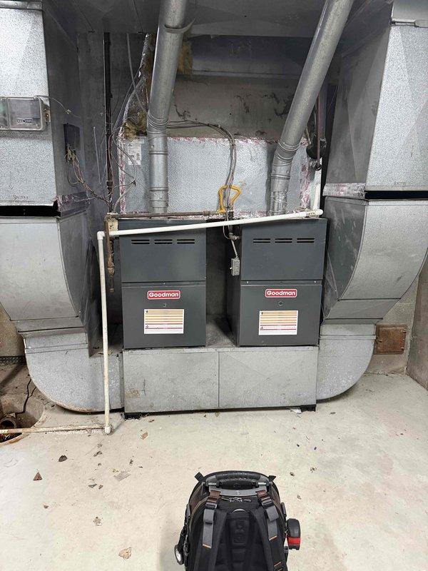 Conducted comprehensive equipment assessment to develop maintenance plan for multiple HVAC systems across two buildings. Documented Carrier furnace unit in Building A and dual Goodman furnaces in Building B, capturing specifications including filter dimensions and belt requirements. Evaluated hanging heaters for accessibility requirements and included small water heater in inspection documentation. All equipment photographed for maintenance planning purposes.