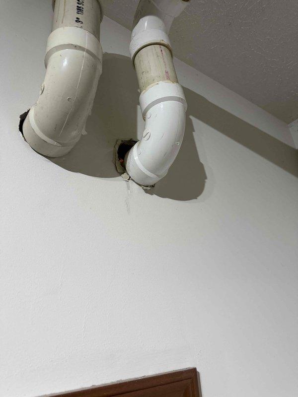 Inspected PVC exhaust/intake venting system after customer reported intermittent heating failure. Observed discoloration and potential condensate buildup at pipe connection points. Cleaned affected areas and verified proper sealing at all joints to ensure proper furnace operation and prevent future exhaust gas leakage.
