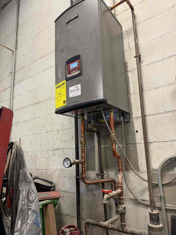 Responded to no-heat call for commercial customer. Diagnosed floor heating system failure due to cutout switch activation. Inspected boiler system and associated plumbing, noting proper operation of pressure/temperature gauge (reading 15-20 PSI at 10-20°C). Reset cutout switch and verified system returned to normal operation.