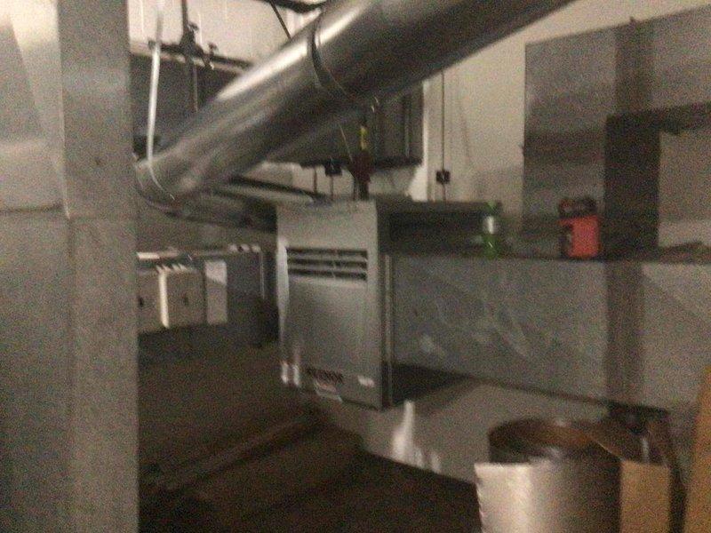 Successfully removed existing Reznor gas fired duct heater and installed new Reznor X-250 model in its place. Replaced 10-inch flue pipe from heater to B-vent tee, ensuring proper ventilation for the new unit. System was tested and confirmed to be operating according to manufacturer specifications.