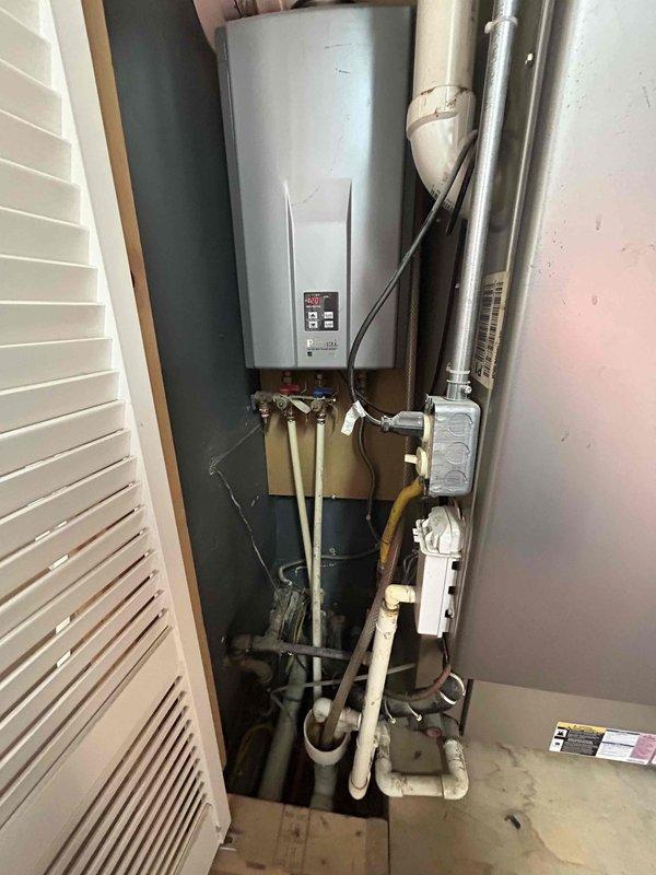 Responded to no-heat call after previous company replaced motor without resolving issue. Inspected water heating system in utility closet, checked electrical connections at breaker panel, and diagnosed proper operation when removed from emergency heat mode. Recommended complete system replacement to ensure reliable heating performance.