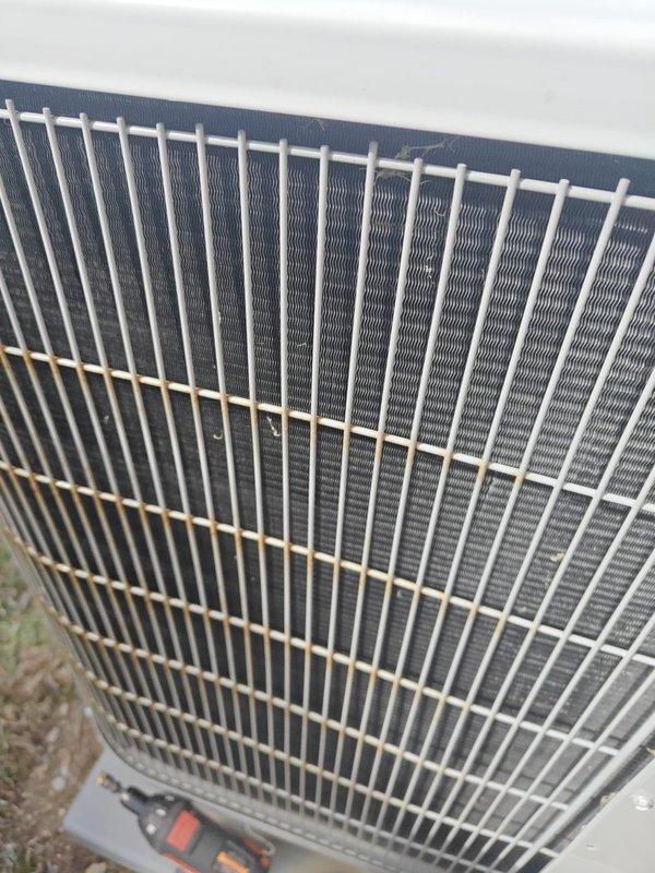 # Service Summary

Completed annual heating maintenance on residential HVAC system. Performed comprehensive system inspection including outdoor condenser unit evaluation, electrical testing, and component verification. Measured electrical parameters using calibrated clamp meter, recording readings of 336 on system components. Inspected condenser coils through protective grille cage, noting clean condition with proper fin spacing. Verified electrical connections and wiring integrity at junction points. All components found operating within normal parameters with no immediate repairs required.