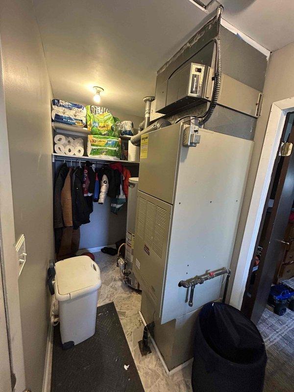 Conducted on-site assessment for complete air conditioning system replacement. Evaluated existing outdoor condensing unit showing significant weathering, cracked condenser coil panels, and debris accumulation, as well as indoor air handler positioned in utility closet space. Provided comprehensive replacement estimate with equipment specifications and installation requirements for both outdoor and indoor HVAC components.