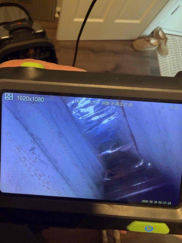 Performed second opinion inspection on heating unit originally installed by our company eight years ago. Customer reported another contractor identified small holes in the heat exchanger. Conducted thorough visual inspection of system components including evaporator coil assembly, which showed normal aging with dust and debris accumulation consistent with operational timeframe. Utilized digital inspection camera with 1920x1080 resolution to perform internal heat exchanger examination, capturing detailed imagery of interior surfaces and potential failure points. Inspection findings documented photographically for customer review and warranty consideration.