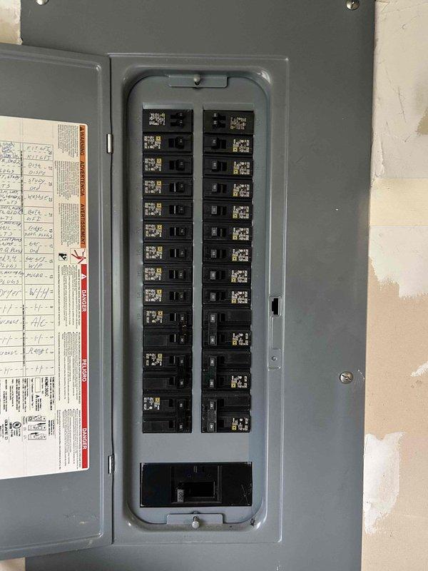 Conducted on-site evaluation for heat pump and furnace replacement system. Assessed existing thermostat controls and electrical panel capacity to determine compatibility requirements for new HVAC equipment installation. Documented current system configuration and electrical infrastructure through photographic records to support equipment sizing recommendations and installation planning.