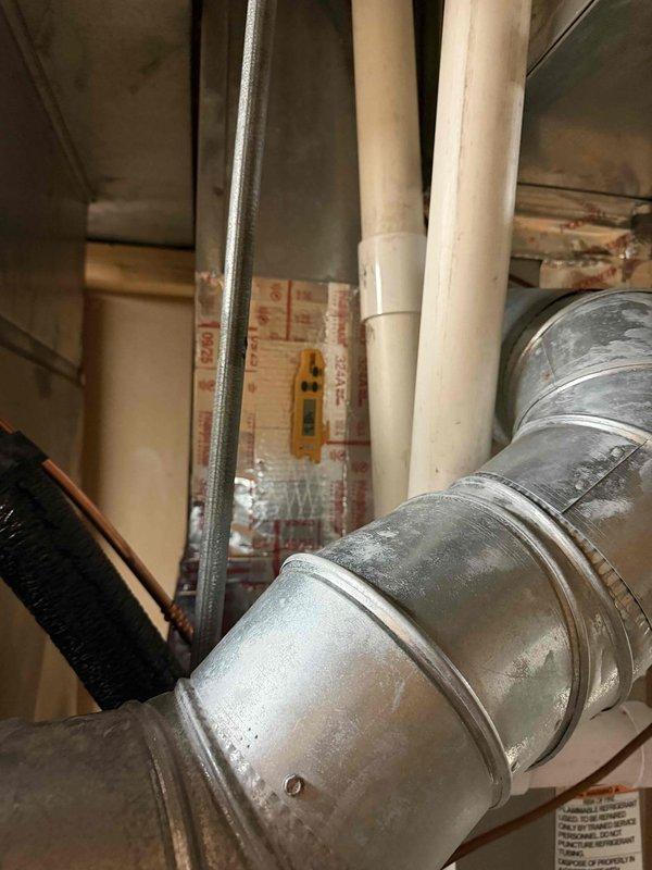 Completed AC start-up on new installation. Verified ecobee thermostat wiring configuration with proper connections at terminal block including C, Y, G, W, Rc, and Rh wires. Inspected ductwork and PVC condensate drain lines in mechanical area, confirmed all components properly installed and system operational.