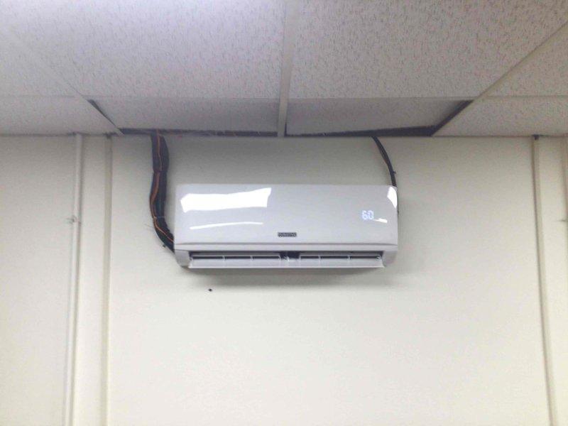 Completed installation of line hide system for wall-mounted mini-split air conditioning unit. Concealed refrigerant lines and electrical wiring from indoor head unit through drop ceiling opening, ensuring clean professional appearance. Verified system operation and proper refrigerant levels using diagnostic manifold gauges at outdoor rooftop equipment location.