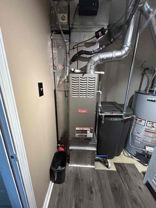 Completed full system replacement estimate for residential HVAC system including existing Bryant furnace located in basement utility room and outdoor condensing unit. Evaluated current equipment condition, ductwork configuration, electrical connections, and condensate drainage system to provide comprehensive replacement recommendations for complete heating and cooling system upgrade.