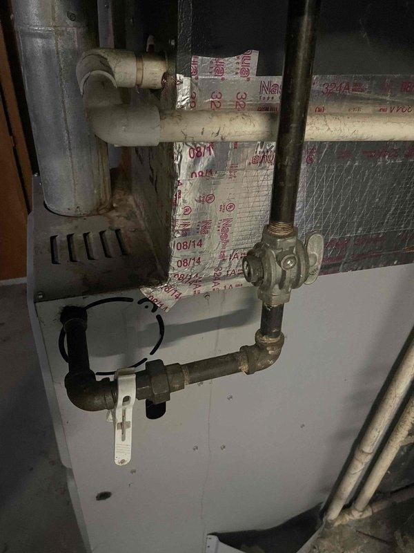 Conducted comprehensive evaluation of existing 3-ton HVAC system for replacement estimate. Inspected attic-mounted equipment revealing extensive condensation on insulated refrigerant lines and ductwork, indicating inadequate insulation and potential efficiency loss. Assessed aged basement mechanical components including deteriorated piping, weathered gas valve assembly, and compromised insulation materials. Documented current system condition showing signs of end-of-life operation and recommended complete system replacement to address moisture issues, improve energy efficiency, and ensure reliable climate control.